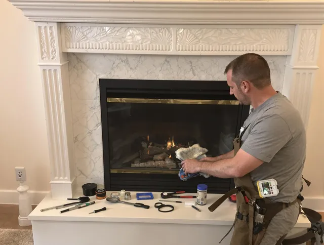 Pembroke Chimney Sweep performing fireplace maintenance in Pembroke, MA
